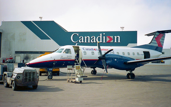 Embraer Brasilia Parked In Front Of Company Hangar